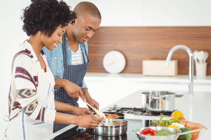 Image of couple cooking in the kitchen